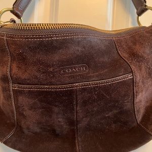 Coach suede shoulder bag dark brown with gold hardware.